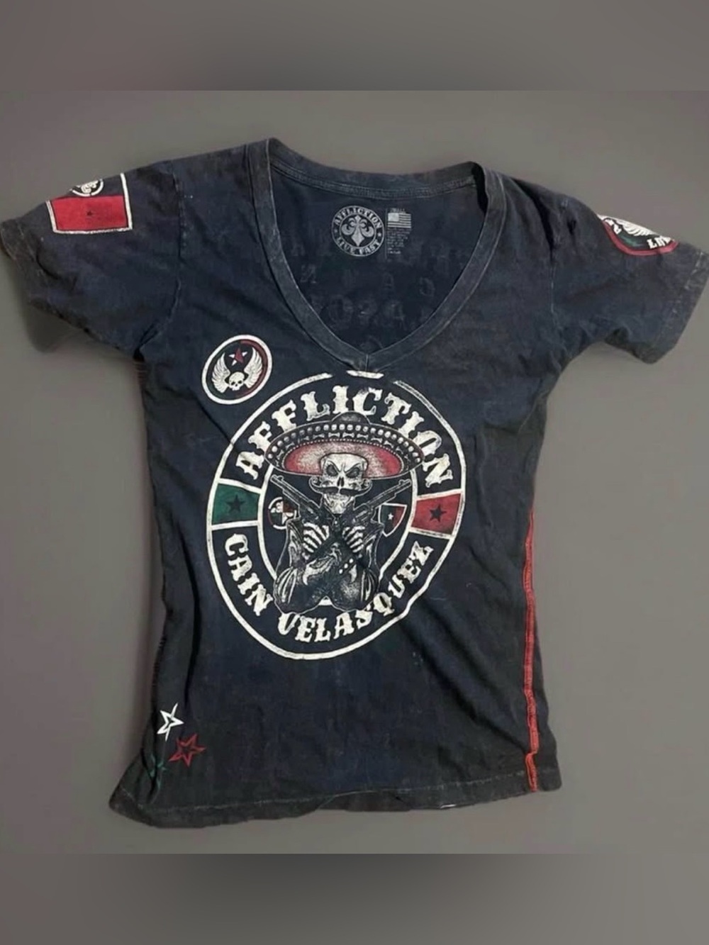 Affliction woman’s Black V-Neck Graphic Tee with Red & Green Accents